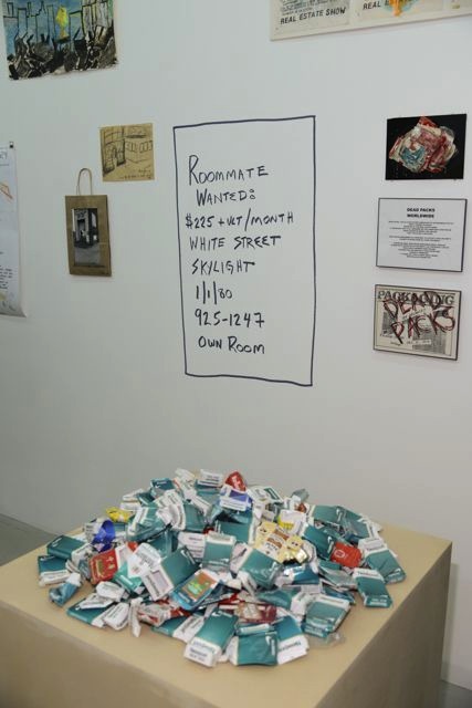 Pile of cigarettes by Robert Goldman (Bobby G); Reconstructed Roommate Wanted sign by Matthew Geller (Image courtesy of Christian Grattan)
