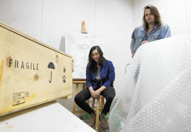 Art handlers Chloe Seibert, left, and Neal Vandenbergh, shown inside Seibert’s art studio, say they want to be represented by a union. (Alex Garcia, Chicago Tribune)