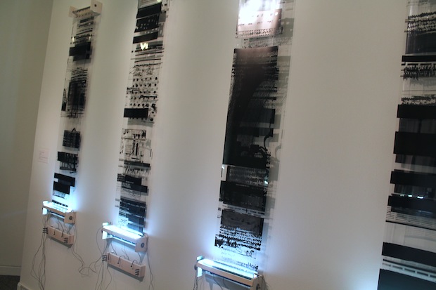Shannon Collis's "Iterations", 2014 (ink on film, DC motors, rollers, LEDs, wire, motors)