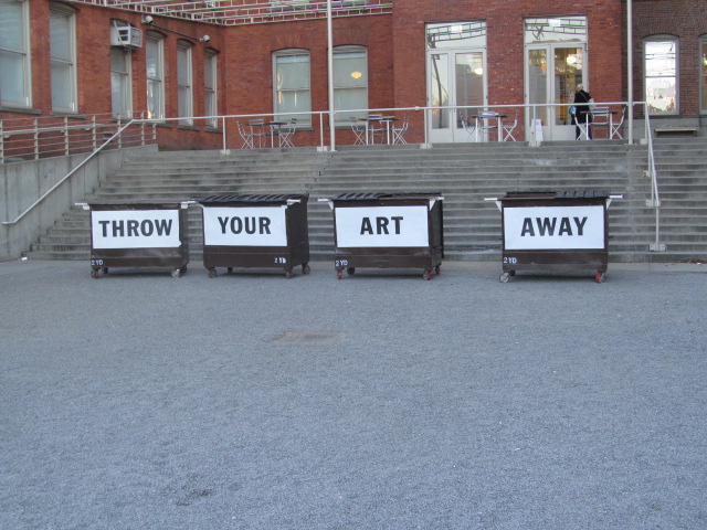 MoMA PS1 courtyard. The trash bins are for Bob and Roberta Smith's Art Amnesty exhibition.