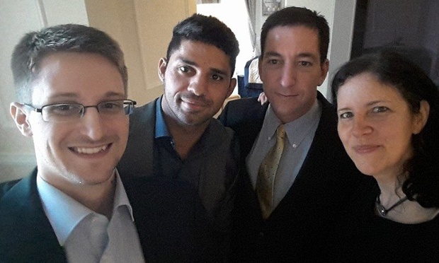 Edward Snowden, far left, with Laura Poitras, far right (Image courtesy of the Guardian)
