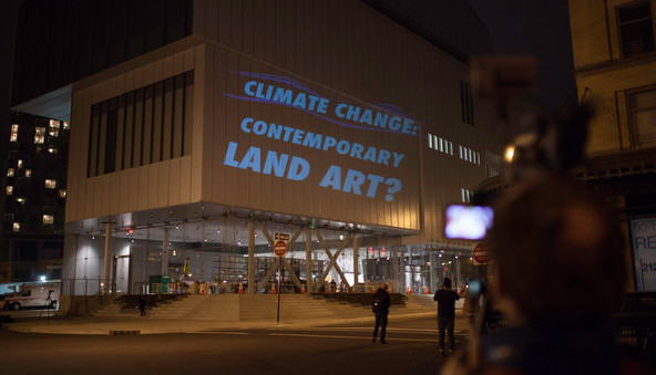 Protesters projected onto the side of the Whitney Source: NYTimes