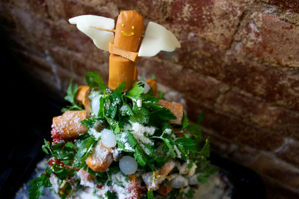 "With a pearl-onion garland, and parmesan snow this hot-dog tree is a holiday party must." Credit: Lucky Peach