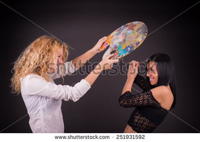 stock-photo-two-female-artists-fighting-251931592