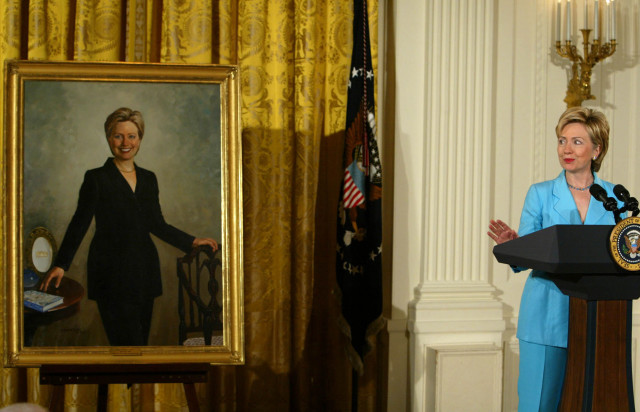WASHINGTON - JUNE 14: Former first lady and U.S. Senator Hillary Clinton (D-NY) speaks while standing near her portrait during a ceremony to unveil Clinton portraits in the East Room of the White House June 14, 2004 in Washington, DC. Every president since George Washington has had their portrait painted and displayed either at the White House or at the Library of Congress. (Photo by Mark Wilson/Getty Images)