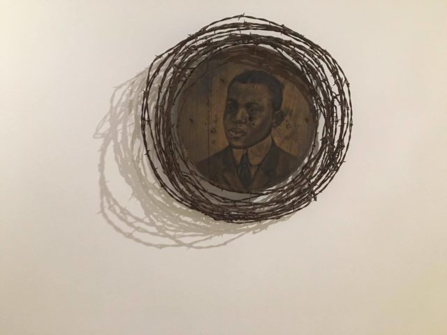 Whitfield Lovell, Wreath, 2000, charcoal, wood and barbed wire