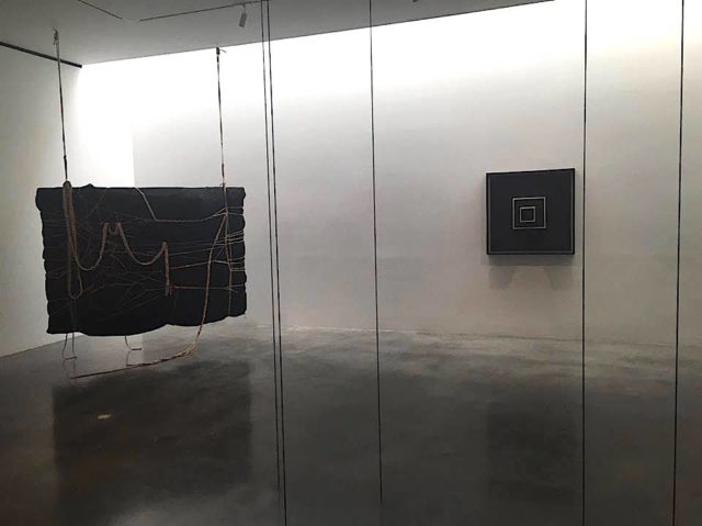 Installation view of Blackness in Abstraction with Laura Lima, Sol LeWitt and Fred Sandback 