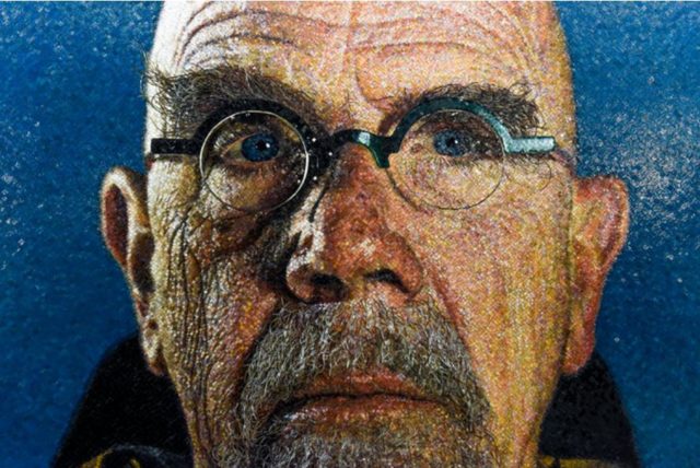 A self-portrait by Chuck Close in the 86th Street station. Photographed by 