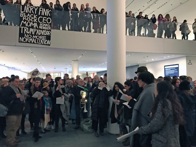 Protesters, including Coco Fusco, at MoMA [h/t Hyperallergic]