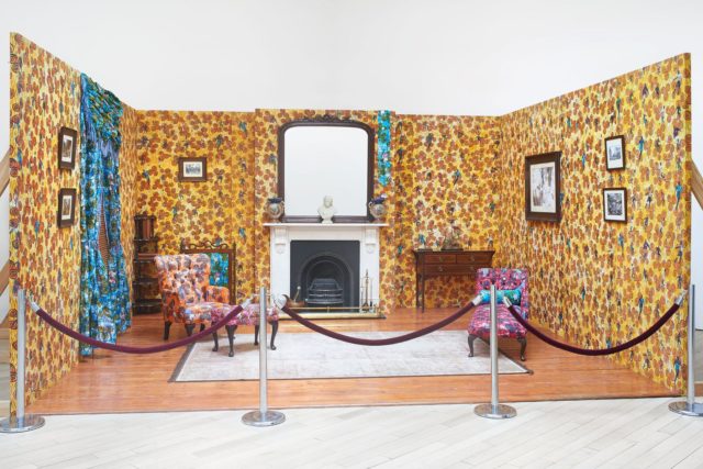 Yinka Shonibare MBE, The Victorian Philanthropist's Parlour, 1996-1997, Dutch wax printed fabric covered wood, cast iron, brass, marble, mirror, bound printed books, porcelain, glass, framed works on paper, and props (Courtesy the artist and James Cohan Gallery; Photo: Phoebe D’Heurle)